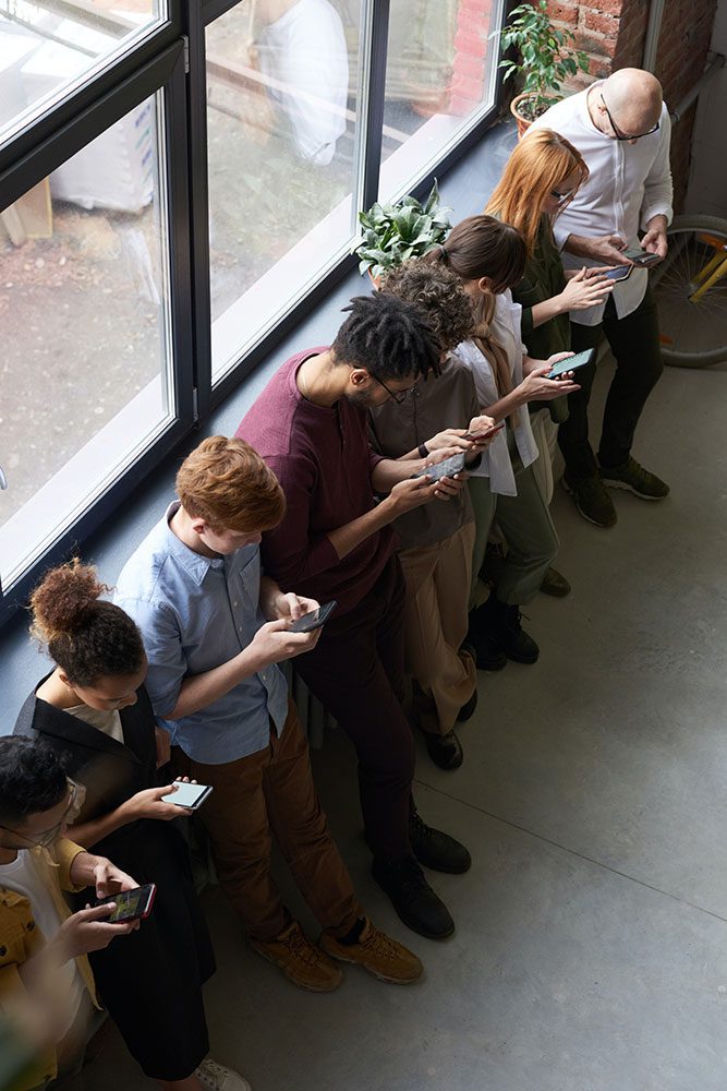 About 4 team using phones